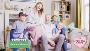 Happy family sat on couch
