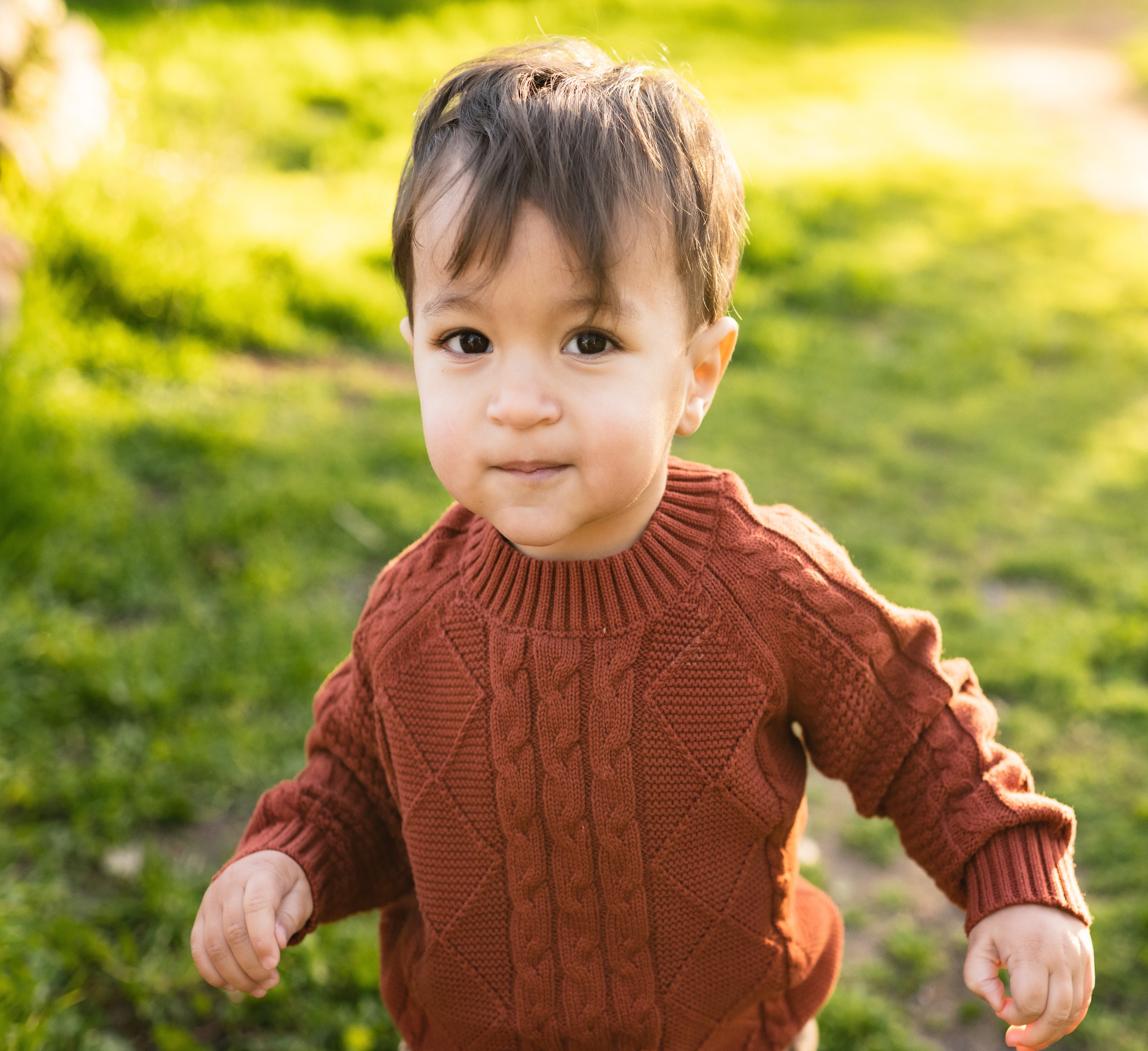 Little boy running on grass