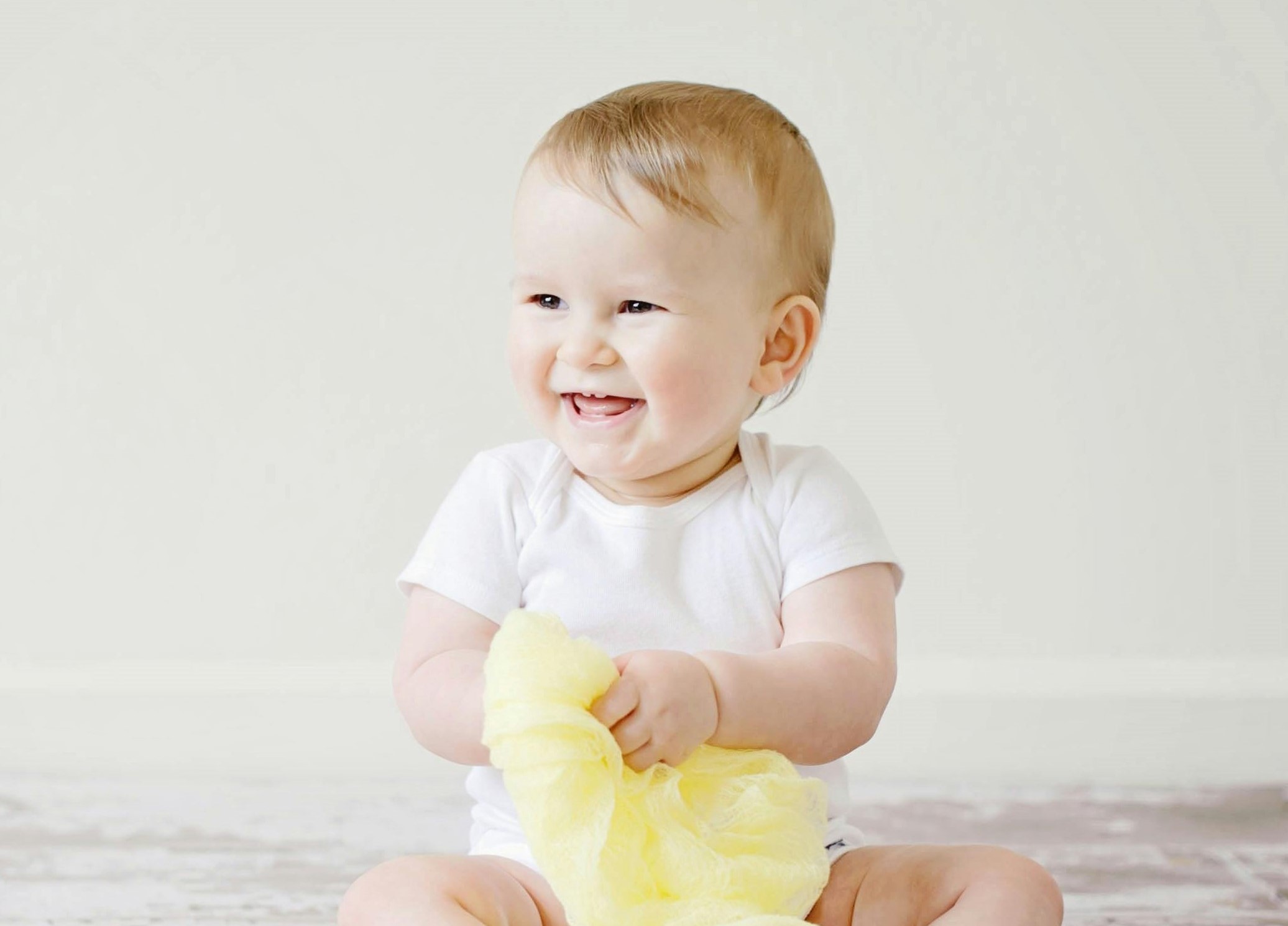 Infant girl smiling for camera