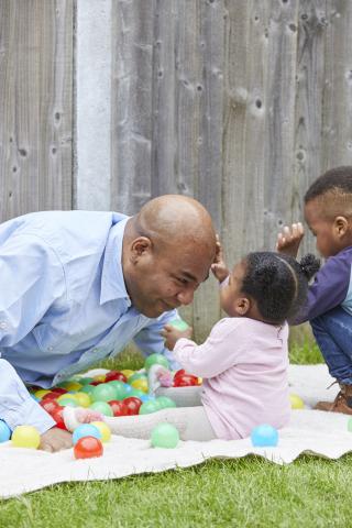 family playing in garden