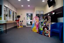 The Grange school Reception ready with various Disney character cut outs for the adoption fun day