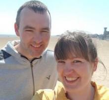 Two adopters together on a beach