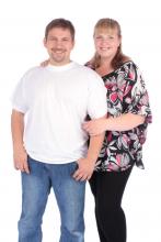 Two adopters standing together