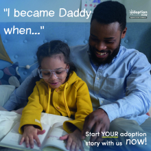Dad reading to his adopted daughter
