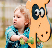 little boy on see-saw