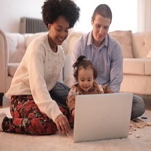 Family watching laptop