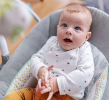 Smiling baby boy in chair