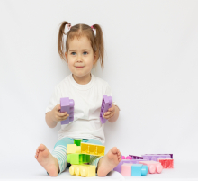 little girl playing with blocks