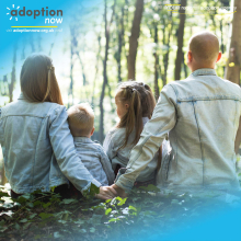 Adoption Now Image for the Benefits of Adoption Blog. The photo contains a family of four with their backs to the camera and the parents holding hands.