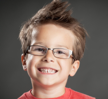 Boy with brown hair and glasses